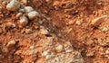 Crumbled red stone rock wall Royalty Free Stock Photo