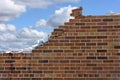 Crumbling brick wall with sky background Royalty Free Stock Photo