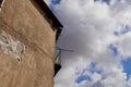 Crumbling concrete house facade in old town of Porto with balcony railing on cloudy sky background. Portugal Royalty Free Stock Photo