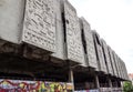 Crumbling concrete wall figures background building