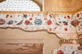 Crumbling layer of the beautiful Persian fresco with birds in garden and flowers