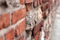 A crumbling old red brick wall background texture in shallow depth of field. stone wall selective focus Royalty Free Stock Photo