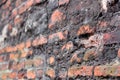 A crumbling old red brick wall background texture in shallow depth of field. stone wall selective focus Royalty Free Stock Photo