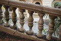 The crumbling railing of an abandoned staircase with palm leaves Royalty Free Stock Photo