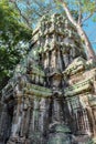 The crumbling stone tower of the Ta Prohm temple complex in the Cambodian forest, ancient Khmer architecture, a popular tourist