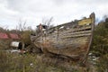 Crumbling wooden boat on the shore