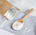 Crumbly xanthan gum in a wooden spoon