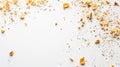 Crumbs and cracker pieces scattered on white surface in a close-up view Royalty Free Stock Photo