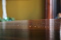 Crumbs and dust on mahogany furniture