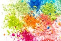 Crumbs of multi-colored chalk on a white background. Joy, Carnival. A game for children. Art