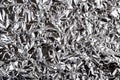 Crumpled aluminum foil texture. Sheet of creased silver foil with shiny folds for background. Metal wrinkled surface as graphic Royalty Free Stock Photo