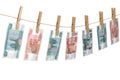 Crumpled banknote of roubles to dry on the rope clothes pins attached
