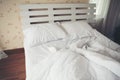 Crumpled bed in the bedroom Royalty Free Stock Photo