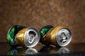 Crumpled beer cans. Two wet empty beer cans with water drops on a brown background, close-up. AMSTEL is a world famous brand from