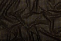 Crumpled black fabric with golden metallic dots