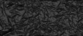 Crumpled black foil texture. Abstract dark textured widescreen background Royalty Free Stock Photo