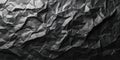 Crumpled black paper with highlights and shadows creating a bold visual statement Royalty Free Stock Photo