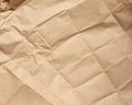 Crumpled blank sheet of brown wrapping kraft paper, vintage texture for the designer Royalty Free Stock Photo