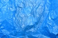 Crumpled blue plastic bag texture. Polypropylene recyclable packaging backdrop Royalty Free Stock Photo