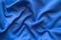 Crumpled blue synthetic fabric. Abstract empty background. Top view. Royalty Free Stock Photo