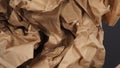 Crumpled brown paper.It is mauled on black background