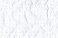 Crumpled checkered page texture background. White mathematics crumpled paper sheet with space for text