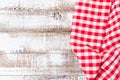Crumpled checkered tablecloth on a wooden table, mock up,top view Royalty Free Stock Photo