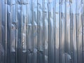 Crumpled Corrugated metal texture or Galvanized iron steel, Abstract background, shiny fence, Silver Colour Royalty Free Stock Photo