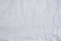 Crumpled cotton white seamless fabric. Texture background Royalty Free Stock Photo