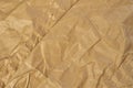 Crumpled creased brown paper background. Grunge texture.  Wrapping sheet Royalty Free Stock Photo