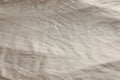 Crumpled dark beige fabric as background, closeup view