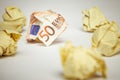 Crumpled euro bill amound office paper Royalty Free Stock Photo