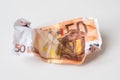 Crumpled euro money. European currency bills of 50 euros on white background. Selective focus. Money value, international, strong Royalty Free Stock Photo