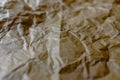 Crumpled and expanded paper with natural texture of reddish tones