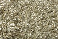 Crumpled foil background. The texture of crumpled iron aluminum gold reflective color. Copy space Royalty Free Stock Photo