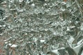 Crumpled foil texture background. Metal paper shit. Silver aluminum surface. Gift wrapping shiny paper. Glitter effect. Royalty Free Stock Photo