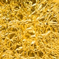 Crumpled glossy gold foil texture Royalty Free Stock Photo