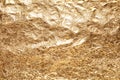 Crumpled gold foil as background