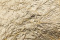 Crumpled gold paper background Royalty Free Stock Photo