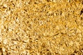 Crumpled golden foil shining texture background, bright shiny gold luxury design, metallic glitter surface Royalty Free Stock Photo