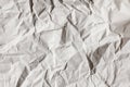 Crumpled gray craft paper texture background. Package wrapping. Old wrapping paper. Baking parchment. Letter template. Royalty Free Stock Photo