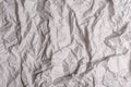 Crumpled gray paper texture. Wrinkled paper background with cracks and kinks. Royalty Free Stock Photo