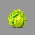 Crumpled green paper isolated on gray background. Paper crumpled into a ball. Recycling, ecology, business. Royalty Free Stock Photo