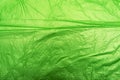Crumpled green plastic bag
