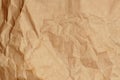 Crumpled kraft paper or cardboard texture for background Royalty Free Stock Photo