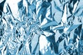 Crumpled light blue foil shining texture background, bright shiny cold icy design, metallic glitter surface Royalty Free Stock Photo