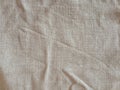 Crumpled linen fabric, natural color background