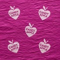 Crumpled magenta paper with a repeating pattern of white apple-shaped logos featurin Royalty Free Stock Photo
