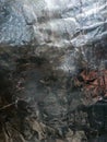 Crumpled metallic foil texture with shabby scratched surface