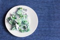 Crumpled money on a plate, Royalty Free Stock Photo